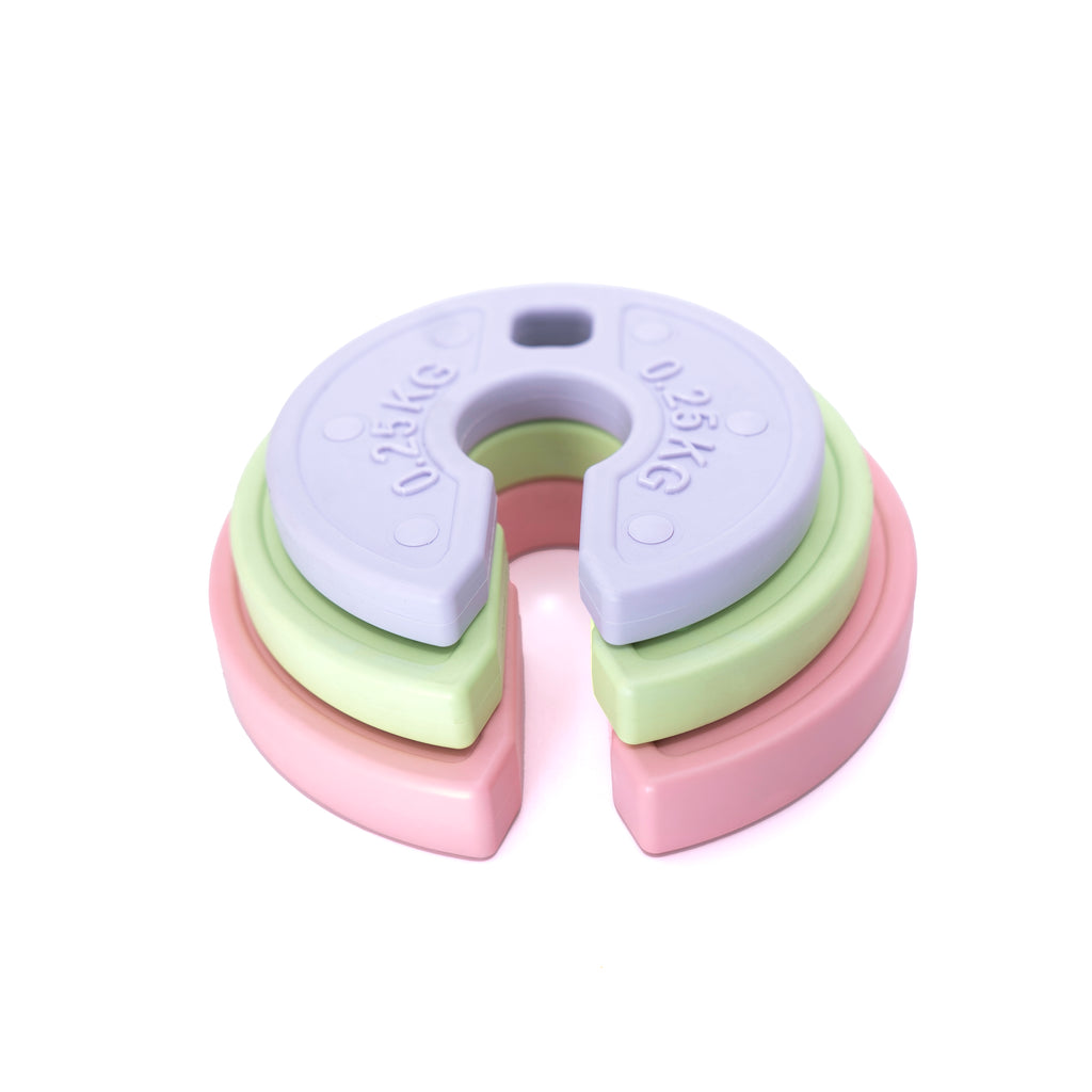 3 micro weight plates stacked on top of each other on a white backdrop